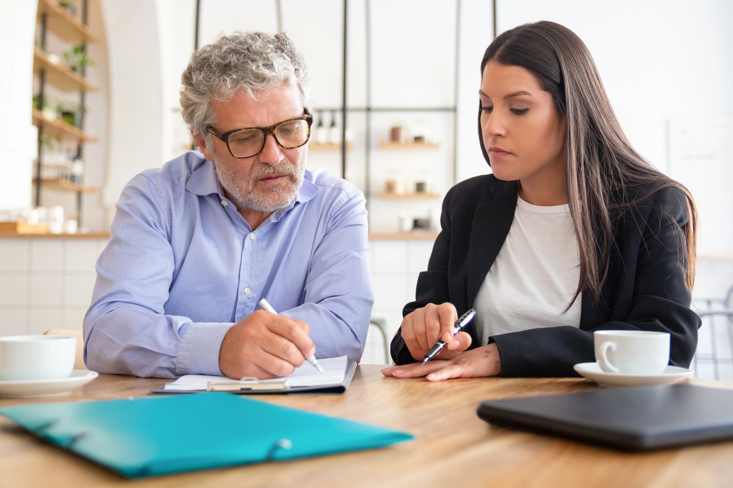 Customer reviewing an agreement with an agent