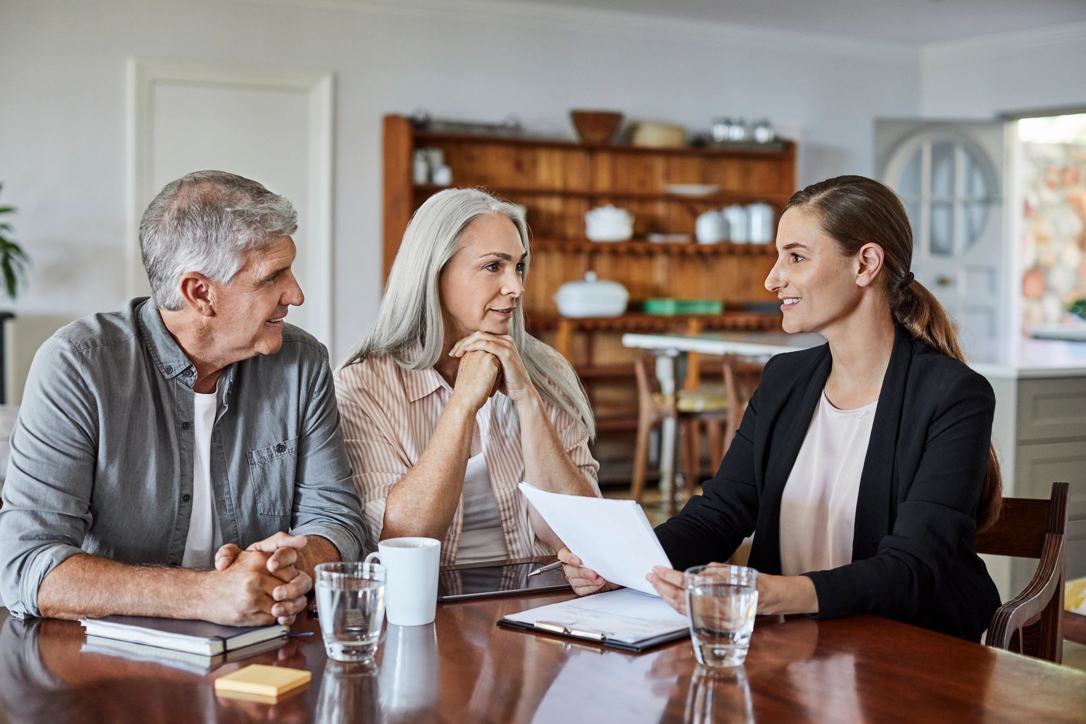 Insurance advisor meeting with a couple at home
