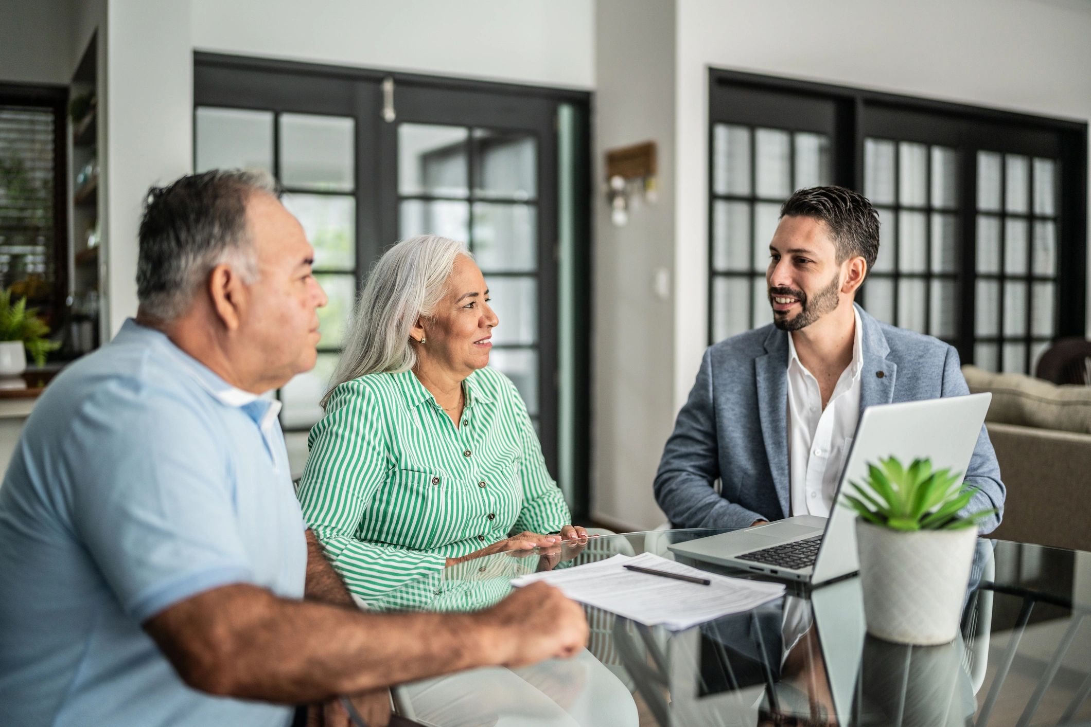 Insurance agent meeting with a family to review coverage options